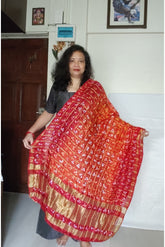 Bandhani Dupatta with Golden Jari palla in Dark Red and Orange color