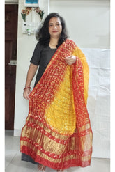 Bandhani Dupatta with Golden Jari palla in Yellow and Dark Red color