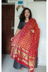 Bandhani Dupatta with Golden Jari palla in Dark Red and Orange color