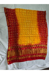 Bandhani Dupatta with Golden Jari palla in Yellow and Dark Red color